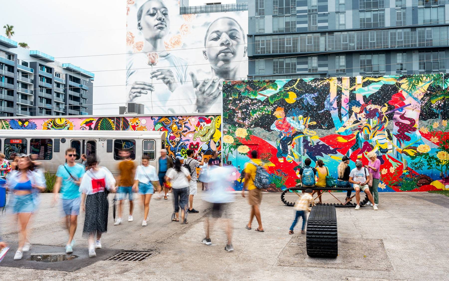 Visitors exploring the murals at Wynwood Walls